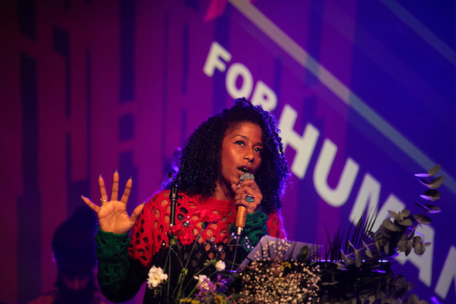 Aja Monet wide stage image at Artists for Humanity