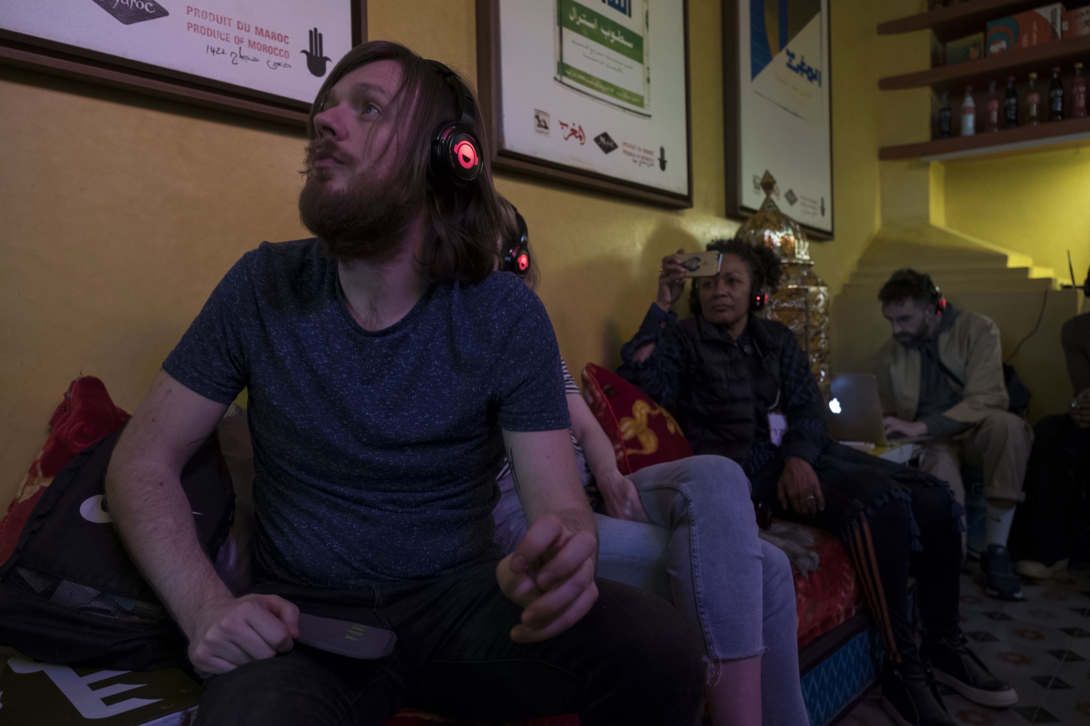 Audience member wearing headphones during the Marrakech Negus presentation